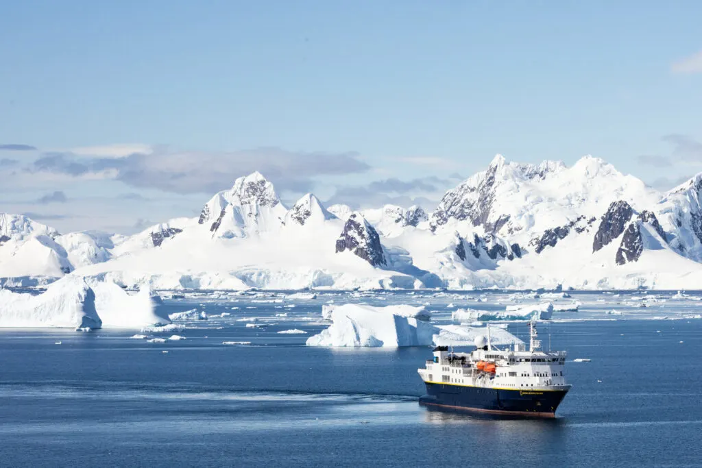 The Lindblad Expeditions National Geographic Explorer in a bay during an Antarctica Cruise.