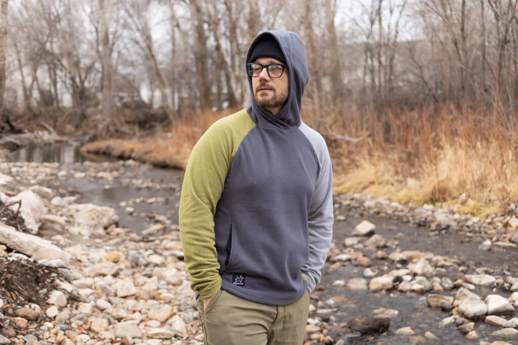 A man wears a grid fleece from SkyGOAT.