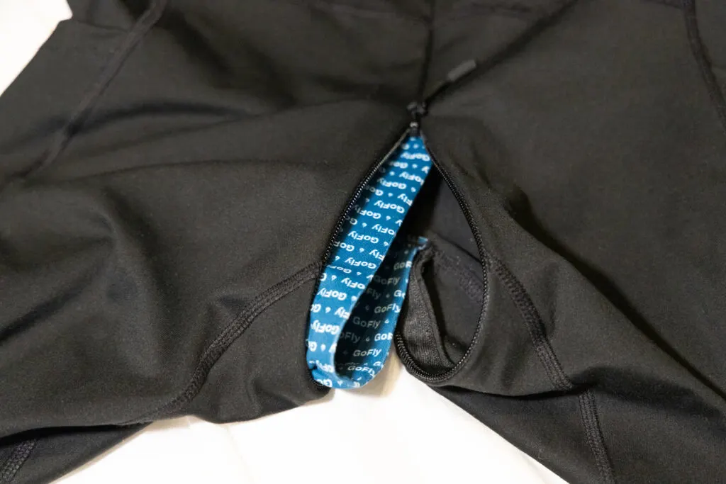 The pee fly unzipped almost all the way so you can see the fabric flap that's on the inside.