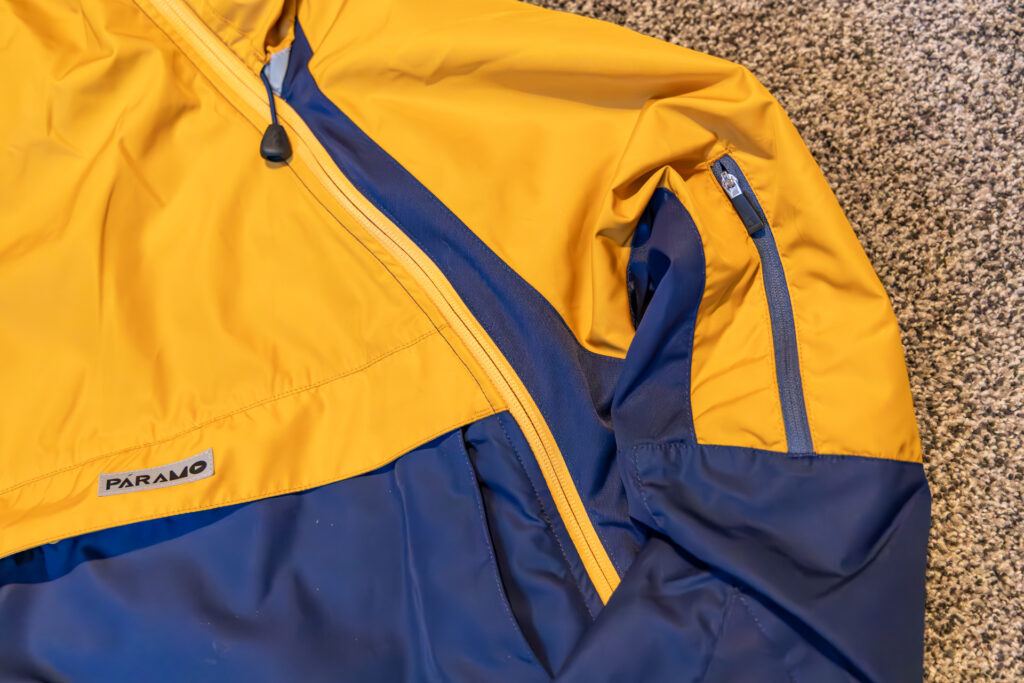 A close-up of the arm vents and one side zipper on the Páramo Velez Evolution Hybrid Smock.