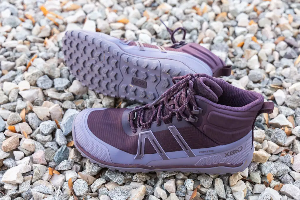 The Xero Shoes Scrambler Trail Mid WP barefoot hiking boots in purple.