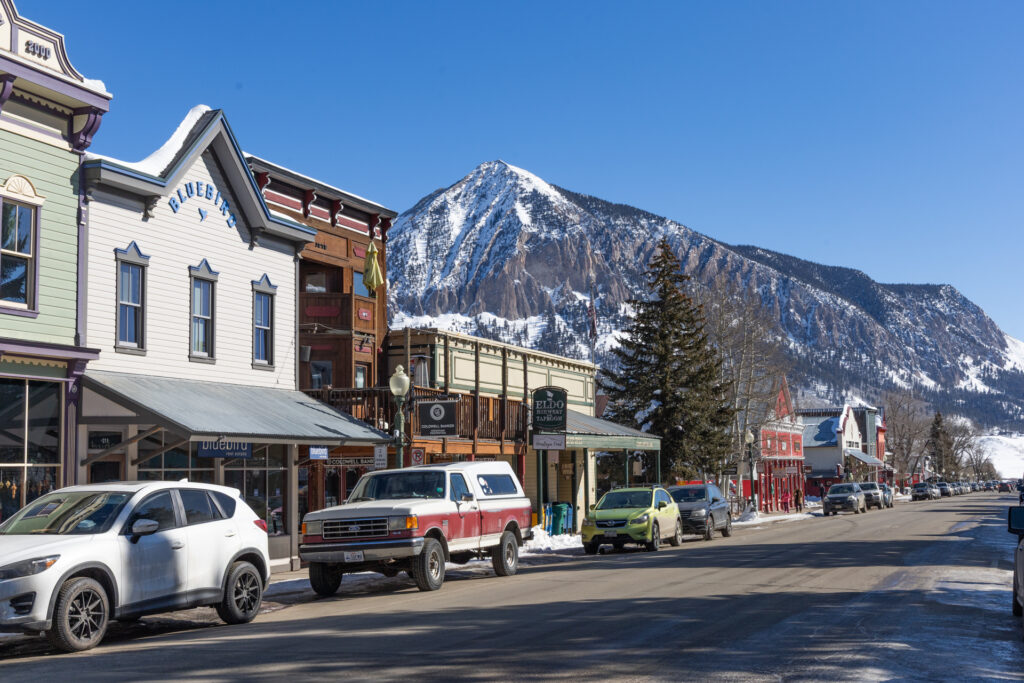 A view of Crested Butte's Main Street (Elk Ave.) in winter. The mountain is in the background.