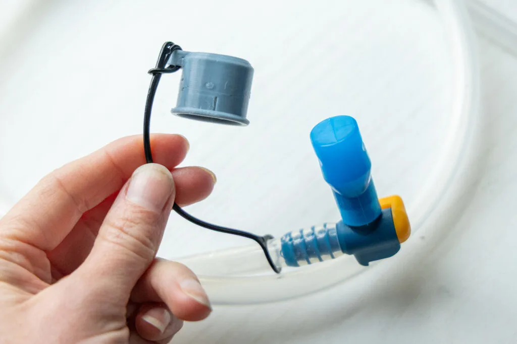 The bite valve and 3-D printed cover on the One Bottle Hydration hose.