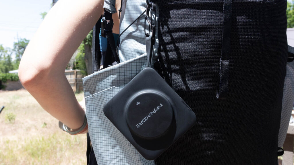 Infinacore P3 Pro clipped onto backpack