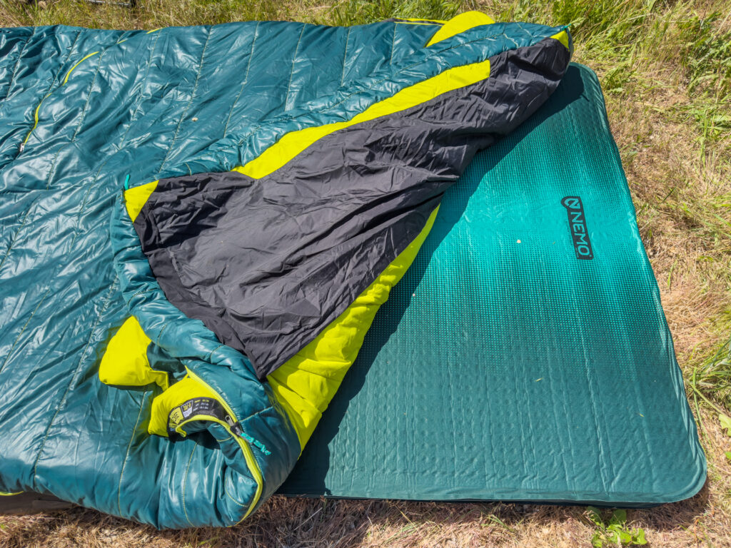 The NEMO Jazz Double sleeping bag's pad sleeves and the NEMO Roamer mattress underneath.