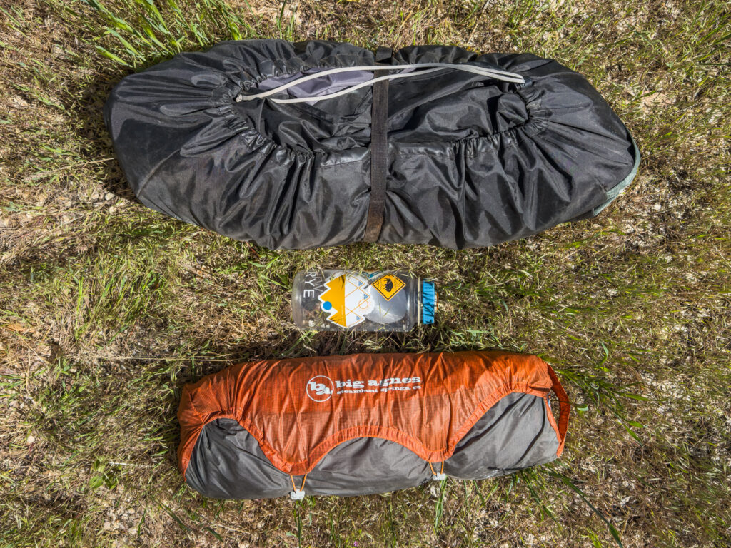 REI Half Dome vs Big Agnes Copper Spur review: Both tents in their stuff sacks. The REI is nearly double the packed size of the Big Agnes.