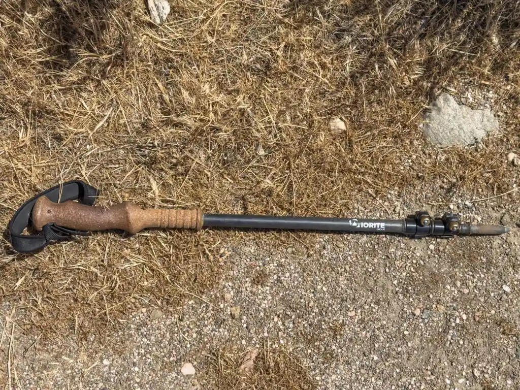 A Diorite Gear ultralight trekking pole collapsed via a telescoping shaft.