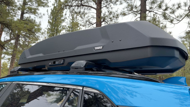 A Thule Force Rooftop cargo box on top of a Rav4.