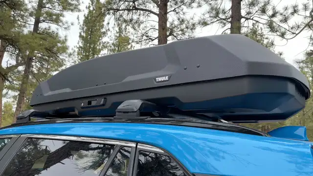 A Thule Force Rooftop cargo box on top of a Rav4.