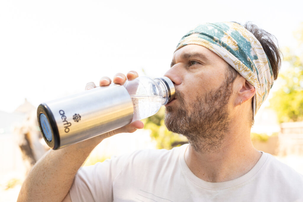 A man drinks out of the Aerflo bottle.