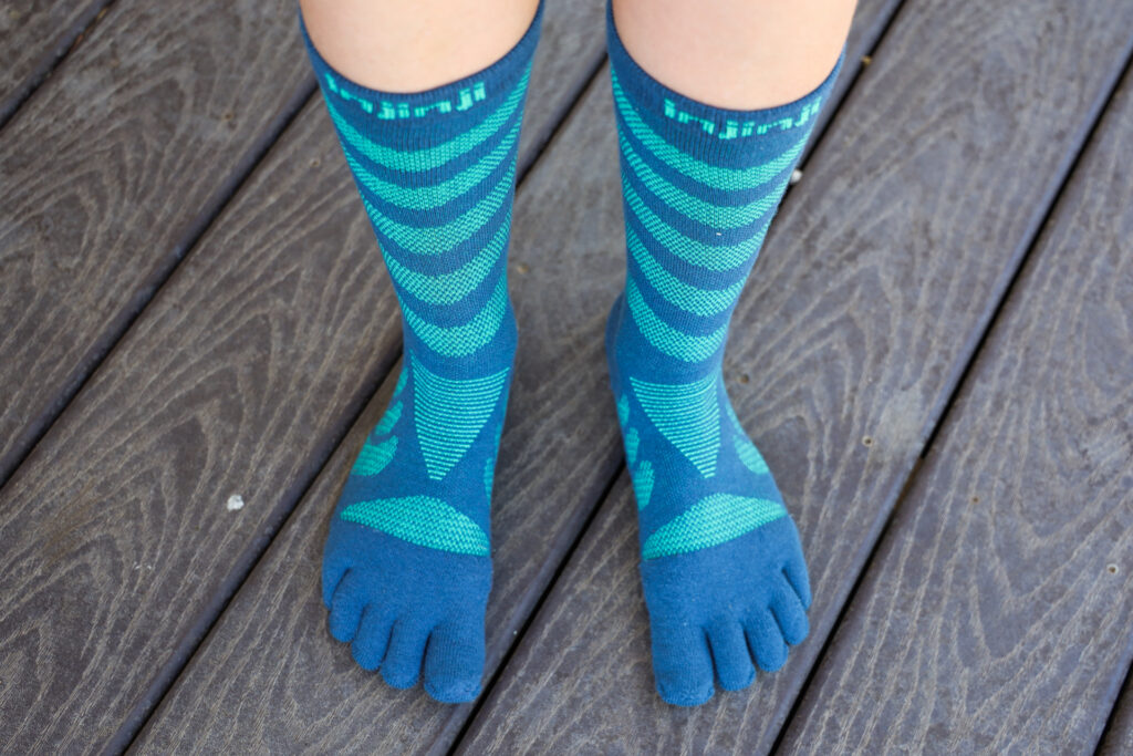 A pair of feet in Injinji Ultra Run Socks.